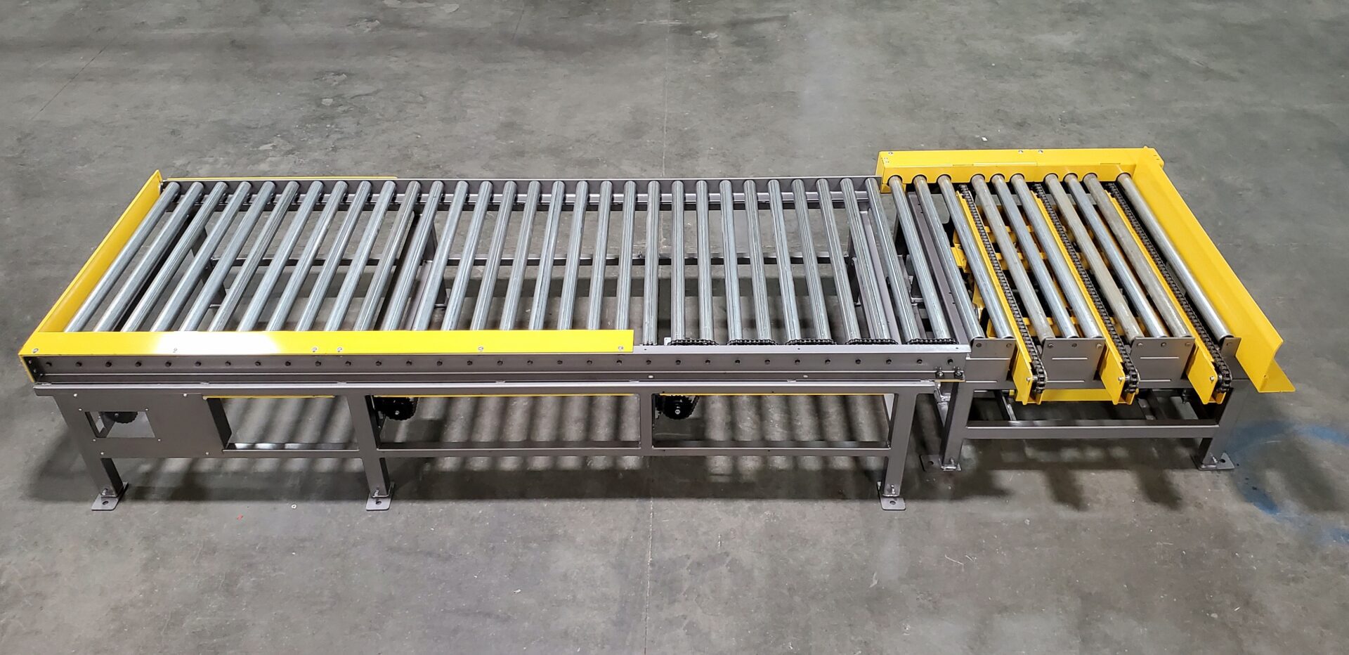 A conveyor belt with yellow bars on it.