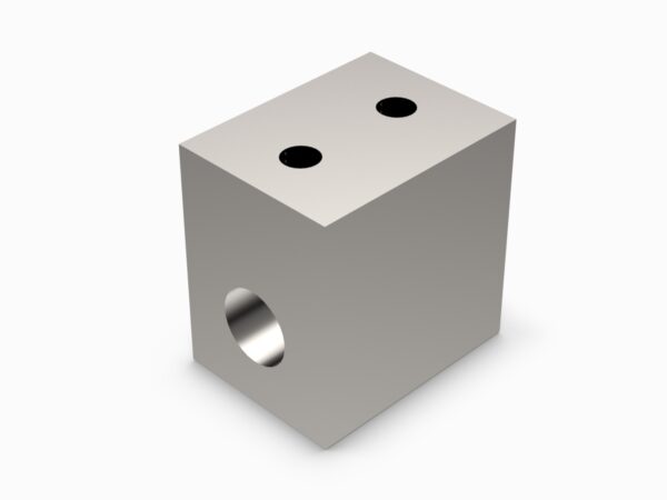 A metal cube with two holes on the side.