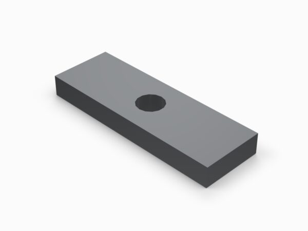 A gray rectangular object with a hole in the middle.