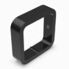 A black square shaped object with a hole in the middle.