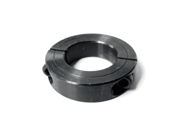 A black metal ring with two holes on it.