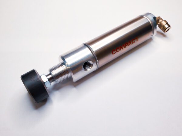 A close up of the side of a small air cylinder