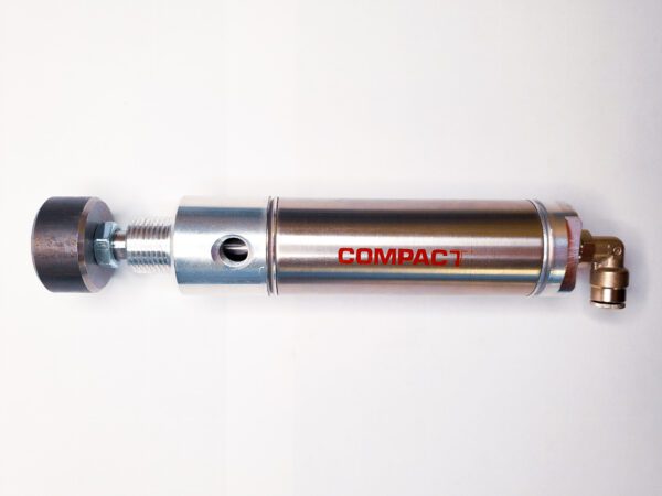 A silver metal tube with red lettering on it.